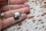 Floating pearl necklace