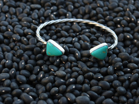 Twisted triangle cuff