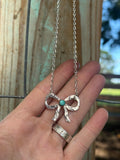 Hammered bow necklace